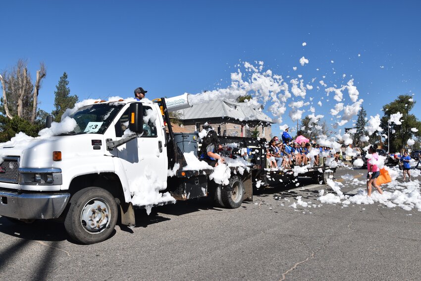 The Weld RE8 School District float featured a foam cannon that blasted suds all over the street and spectators Sept. 9 during Fort Lupton's annual Trappers Day Parade.